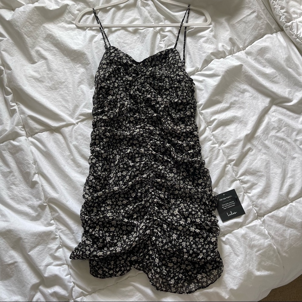 LULUS- Black body con dress with flower design.